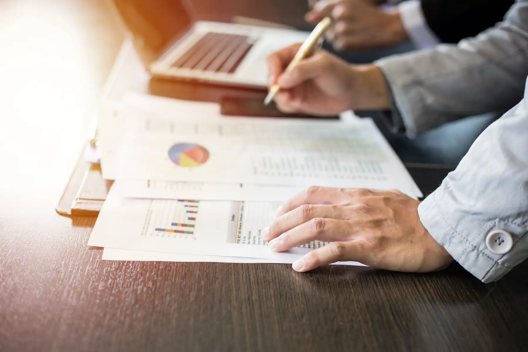Business Team verifying annual financial growth